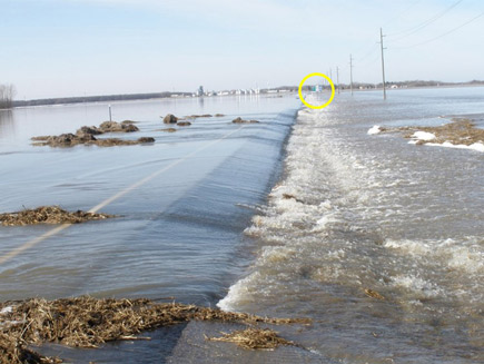 flooding over road near powerline