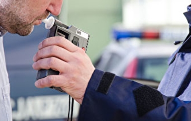 Man taking a breathalyzer