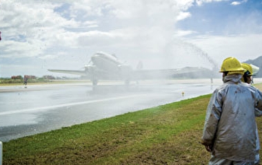 Firefighters spraying a plane on a runway