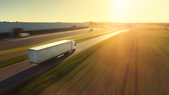 Semi truck driving down a highway