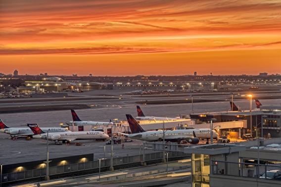 Delta airplanes parked at an airport terminal