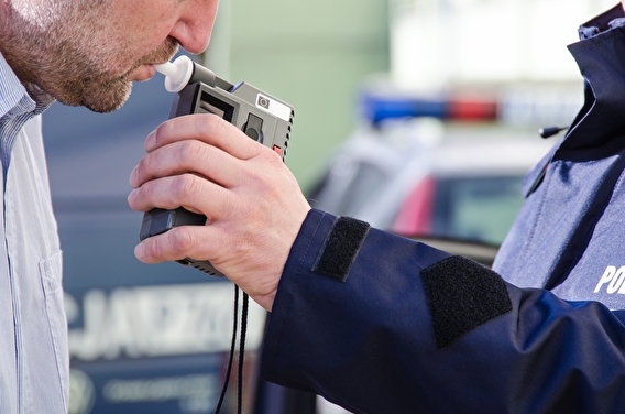 Man taking a breathalyzer test