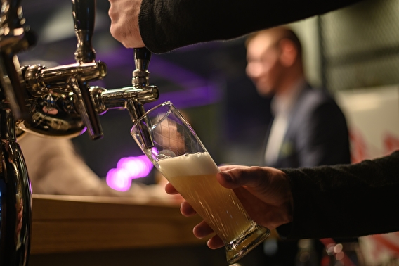 Bartender pouring a draft beer